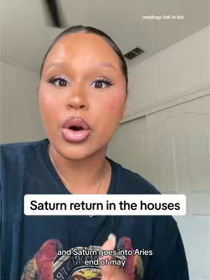 A selfie-style video featuring a woman with dark hair and wearing a black shirt with a graphic. She is indoors, likely in a home setting, with a white door or wall visible behind her. The lighting appears to be natural, and the composition is a close-up, focusing on her face, with a hook text overlay.
