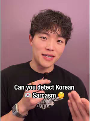 A young man with short, dark, curly hair and braces smiles at the camera. He wears a black t-shirt. Text overlays the image.