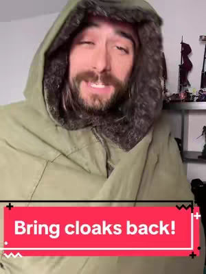 A man in a hooded jacket with fur trim, the text overlayed at the bottom reads "Bring cloaks back!"