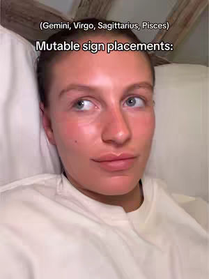 A close-up shot of a woman lying in bed, with soft lighting and a neutral background. The text overlayed on the image lists mutable sign placements.