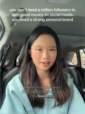 A woman is looking into the camera while sitting in a car. Text overlays are on the top portion of the image, and in the bottom portion. The lighting is diffused.