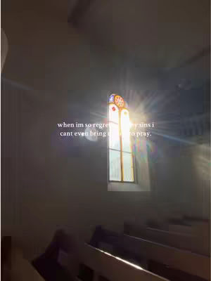 The image shows a view inside a church. A stained-glass window is letting sunlight in, creating a bright, central area. The window has an intricate design, and the sun's rays are streaming through it. Dark pews are visible in the foreground, and a light, somewhat blurry ceiling is above. Text overlayed on the image adds to the narrative.