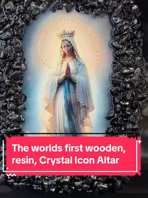The image displays a wooden altar, with an ornate image of a saint in the center, surrounded by a frame of dark stones. The saint is depicted in a traditional pose, with hands clasped in prayer, haloed by a golden light. Below the central image, a red banner contains white text.