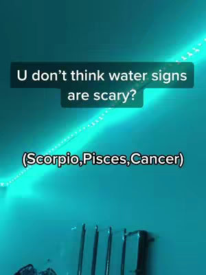 The cover image is a vertical shot of a wall with a teal color. There is string lights in the top right area. In the middle, there's a a rectangular shaped box with text overlayed over it. The text is written in white and the background color is black. Underneath the text a text is written in parenthesis. The background is teal. There is a metal part in the buttom right.