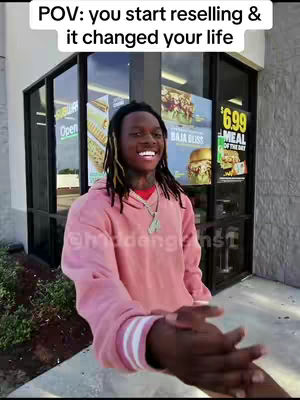 The cover image shows a young man smiling while standing outside a shop. The man is wearing a pink hoodie. Visible in the background is the front of a shop with a sign that says "Subway". The image composition focuses on the man with the shop in the background.