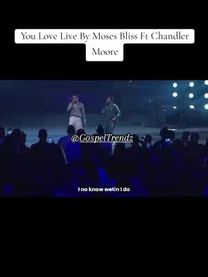 The cover image shows a live performance on a stage. Two men are singing into microphones, with a blurred audience visible in the foreground. The stage is lit with stage lights offering a blue and purple color scheme. Text overlays denote the song's title, the artists, and the name of the venue, while lower text says 'I no know wetin I do'.