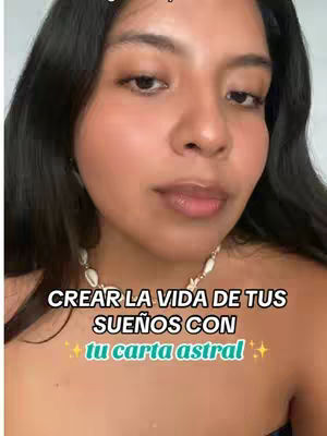 A selfie-style image featuring a young woman against a soft-focus background. She has dark hair and is looking towards the camera with a slight smile and wearing a necklace. Text overlaid on the image promotes a connection between creating the life of one's dreams and using their birth chart.