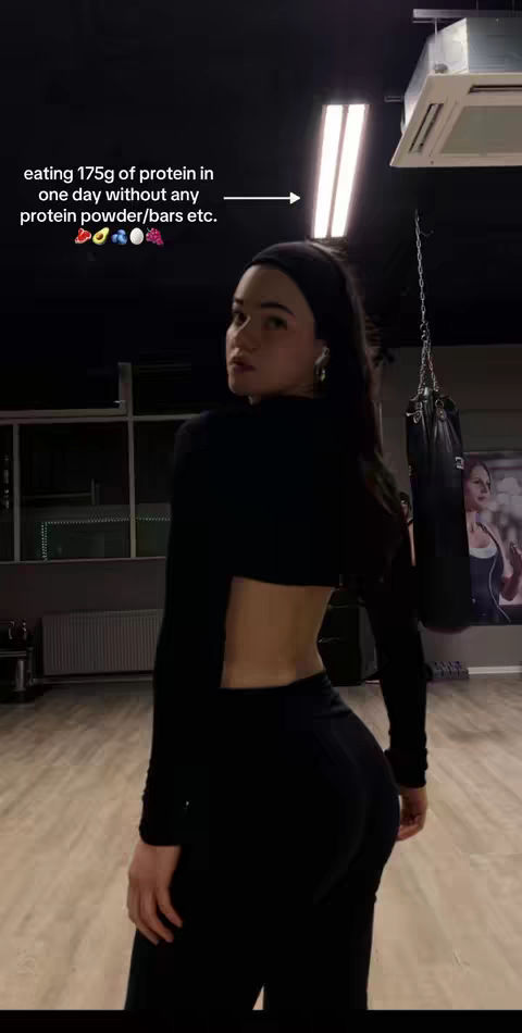 The cover image shows a woman in a gym. She has black leggings and crop top. The gym is dark. There is text on the top left.