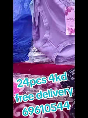 The image presents a vertically-oriented view of a product arrangement. In the foreground, there are multiple pairs of women's underwear, in a light purple color, with lace details visible. Beneath, a burgundy fabric or cloth with flowery pattern serves as a surface. Overlaid centrally, large text provides information about the items.