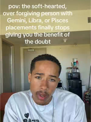 A close-up shot of a young man with short, dark hair and a neutral expression. Text overlays the top part of the image. The background includes glimpses of a door, walls, and a microwave, suggesting an interior setting like a home.