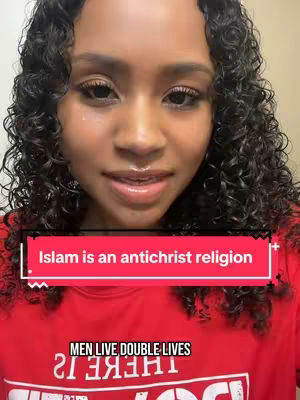 A woman with curly dark hair is centered in the frame. A text overlay reads 'Islam is an antichrist religion' on a red background, while a second text overlay in the bottom center says 'MEN LIVE DOUBLE LIVES'. The woman is wearing a red shirt.