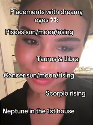 A close-up shot of a woman with soft, pink makeup and a black top. Text overlays list astrological placements.
