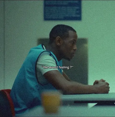 The cover image shows a man in a seated position, slightly turned to the side, with a contemplative expression. He's wearing a teal vest over a white shirt. The background is blurred with the colors of the image being muted with a slight yellow hue.