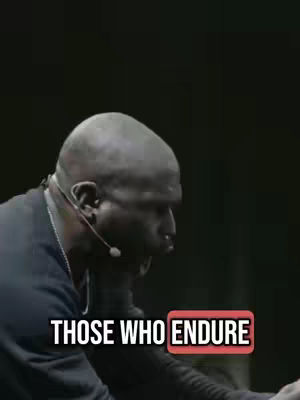 The cover image shows a close-up of a dark-skinned man, seen from the chest up, with a shaved head and a microphone headset. The man appears to be speaking or singing, his mouth open. Below the man, text overlays read, "THOSE WHO ENDURE," outlined in a red rectangular box. The background is a dark, blurred setting, likely a stage.