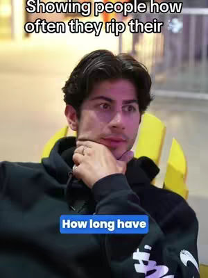 The cover image shows a young man with dark hair in a casual setting. He is wearing a black hoodie and has his hand on his chin, with a thoughtful expression. Text overlays are present, indicating the video's context.