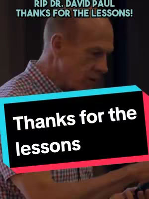The cover image is a memorial for Dr. David Paul. It features a man in a checked shirt as the background, with text overlays at the top and a colored shape covering part of the image. The overlays read "RIP DR. DAVID PAUL THANKS FOR THE LESSONS!" at the top, and "Thanks for the lessons" inside a black shape outlined with teal and pink, suggesting a tribute to a teacher or mentor, possibly related to trading.