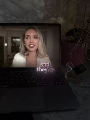 The cover image shows a laptop displaying a video on its screen. The video features a woman with blonde hair and a white jacket. The text overlay on the video reads "and they're" with a purple hue, while the surrounding environment includes a blurred background, a plant pot, and a perfume bottle.