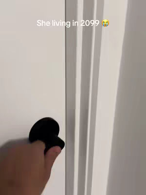 Cover image shows a hand turning a black doorknob. The door and surrounding wall are white with vertical molding.