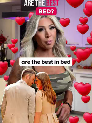 The cover image features a woman at the center wearing a camouflage top. She's smiling and looking up, with a white rectangle over the bottom of her chest. The background is a kitchen or dining room with cabinetry and a bright overhead light. Floating around the top half of the frame are various red heart emojis.