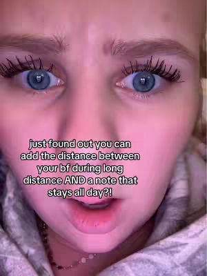 An extreme close-up of a person's face with bright blue eyes, wide open and looking upward. The skin is pink, and some text is overlaid.