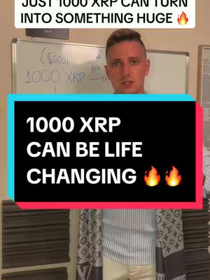 A man in a white shirt and patterned scarf stands centered in front of a whiteboard with handwritten notes. The text overlay displays a clear announcement about XRP cryptocurrency, accompanied by flame emojis.