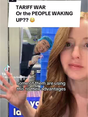 A selfie-style video cover with a woman in the foreground, partially obscuring a shot of a person working in what appears to be a laundry or processing facility. The top portion features overlaid text about a"tariff war" and "people waking up". Text overlayed at the bottom of the foreground says "some of them are using this to their advantages"