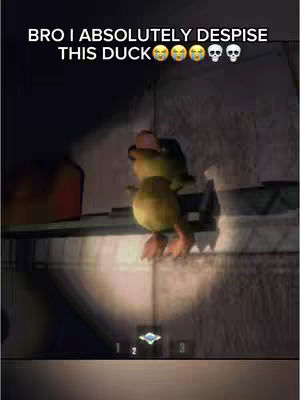 The image features a low-angle shot, likely from a video game, showcasing a yellow duck-like character hanging from a ledge. The character has a surprised expression. Overlayed text at the top reads "BRO I ABSOLUTELY DESPISE THIS DUCK" followed by several emojis. The background is dark and appears to be an indoor setting, with lighting from a source near the character.