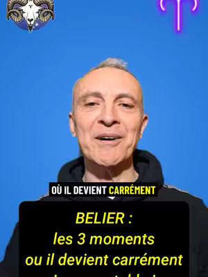 A man is centered in the frame, with a blue background. The man is smiling slightly, with a text overlay on the bottom of the frame. In the upper left corner is an image of a ram's head, and in the upper right corner is a neon image of the Aries symbol.
