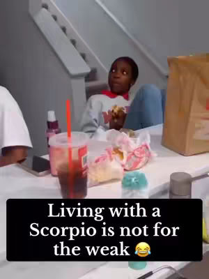 The cover image shows a kitchen scene with a person looking up and to their right, seemingly reacting to something off-camera. Food items and a drink are on the table in front of them. Text overlayed at the bottom reads, 'Living with a Scorpio is not for the weak' with a laughing emoji.