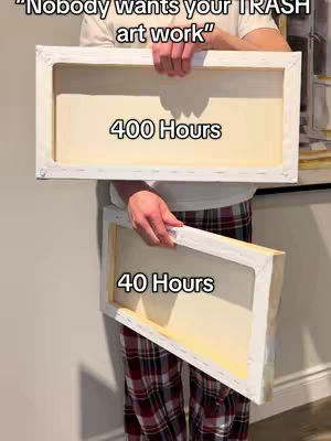 A person holding two blank canvases, one larger and one smaller, with text overlays on each. The larger canvas reads '400 Hours' and the smaller one '40 Hours.' The person is wearing a white shirt and plaid pants. The background is a neutral wall.