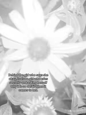 Black and white photograph of several daisy-like flowers, with the petals of the central flowers in sharp focus while those in the foreground are slightly blurred. Text overlayed in a semi-transparent box at the bottom, with rounded corners.