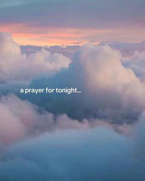 An image depicting a cloudy sky at sunset, with hues of pink, orange, and blue. Large, puffy clouds fill the foreground. Text overlayed in a soft font reads, 'a prayer for tonight...'