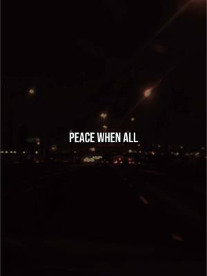 The image shows a night-time cityscape with city lights and a dark road. Text overlay in the center reads 'PEACE WHEN ALL'. The overall composition is dark but hopeful.