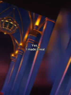 The image shows a blurred artistic background of blue and gold colors, with text overlaid. The focus is on a sense of ethereal or otherworldly quality, with elongated vertical structures suggesting a building interior.