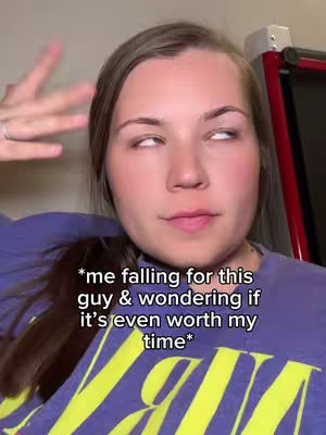 A young woman with light brown hair is the primary focus, looking off to the side with a slightly amused or eye-rolling expression. Overlay text adds a relatable sentiment about relationships. The lighting is natural, and the composition is a close-up, creating a sense of intimacy.