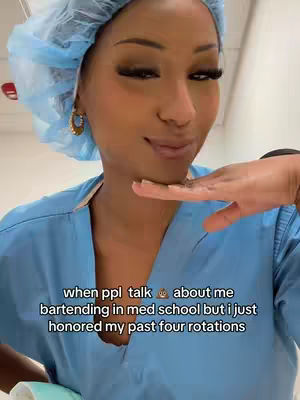 A woman in medical scrubs and a surgical cap is angled slightly towards the camera, with a surprised or contemplative expression. She has a hand near her chin. Text overlays at the bottom of the image.