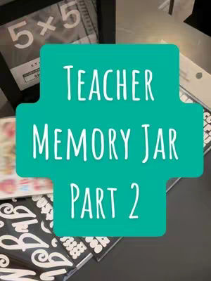 The cover image is a square-shaped graphic with a teal, plus-shaped background holding white text. The background has framed photos around it, hinting at the contents of the video. The text reads 'Teacher' above 'Memory Jar' and 'Part 2' below, indicating a series.
