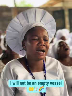 A woman in a white head covering and white clothing is emotional, with her mouth open. Text on the image states 'I will not be an empty vessel'.