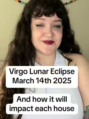 A woman with long dark wavy hair is smiling at the camera. She has dark lipstick and makeup. White text boxes are overlaid on the image with the video title.