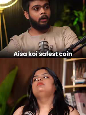 The cover image is split in half vertically. The top half shows a man with a beard, wearing a light-brown shirt, and speaking into a microphone. The bottom half shows a woman looking up with a slight smile. The text overlayed at the top says, 'Aisa koi safest coin'.
