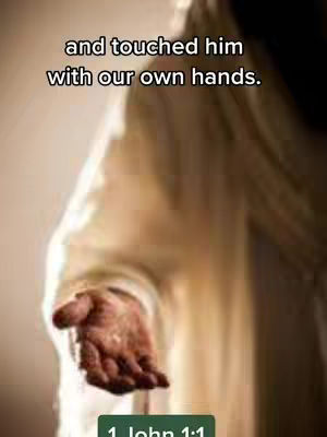 The image shows a person in a cream-colored robe, with their arm extended. The palm is facing towards the viewer and the hand is slightly cupped as if offering or receiving something. The background is blurred, with an overall soft and warm lighting.