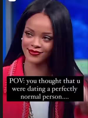 A close-up shot of a woman with dark hair, bright red lipstick, and a red blazer looking sideways with a slight smirk. A text overlay in a black box reads, 'POV: you thought that u were dating a perfectly normal person....'