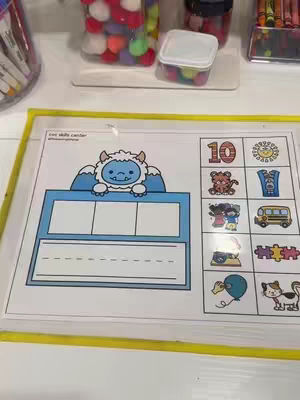 The cover image displays a worksheet for a kindergarten activity. The worksheet is placed inside a clear plastic sheet. There is drawn an yeti at the top of the sheet that looks like it's holding the worksheet.