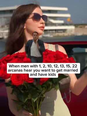The cover image features a woman holding a bouquet of red roses, wearing sunglasses, and small cutout image of a man overlayed above the roses. Text overlayed on the image. Behind them is a blurred outdoor urban background with buildings and a body of water.