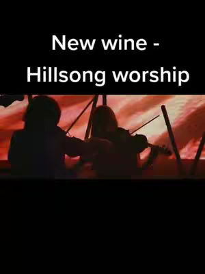The cover image features a dark background with silhouetted figures of people playing musical instruments, likely violins, in an enthusiastic manner. Text overlays the image, providing the title and artist information.
