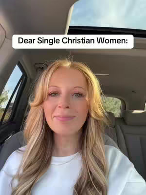 A woman with long blonde hair is seated inside a car. She's looking toward the camera with a slight smile. The background reveals the car's interior and an overhead view through the open sunroof, showing the sky. A white text overlay appears at the top, which says: Dear Single Christian Women:.