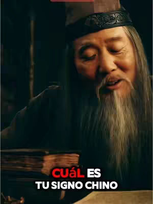 The image features an older Asian man in traditional clothing, with a long white beard, seated and looking downwards. Text overlays in red and white ask, "CUÁL ES TU SIGNO CHINO" (What Is Your Chinese Sign). The lighting is dim, creating a sense of mystery.
