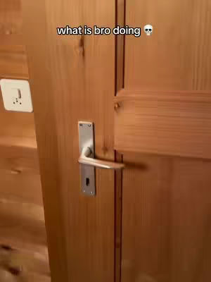 The cover image depicts a wooden door with a metal handle and a wall outlet to the left. Above the door is a text overlay.