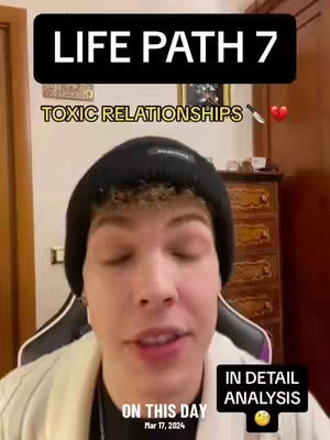 A selfie-style video cover featuring a young man with a black beanie indoors. The upper part of the image has overlaid text in black boxes, and the lower part has text indicating the date. The background shows a room with a wooden cabinet and artwork.