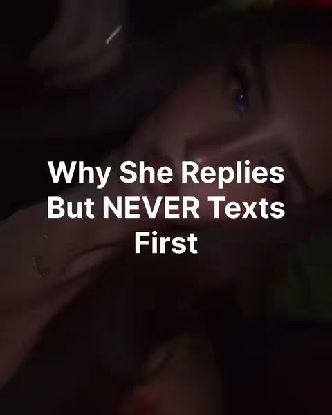 The cover image features a close-up of a woman's face, likely in a dimly lit setting. The primary text overlay is in white, stacked vertically, and reads "Why She Replies But NEVER Texts First". The woman's eye and some of her hair are visible, adding a sense of mystery.
